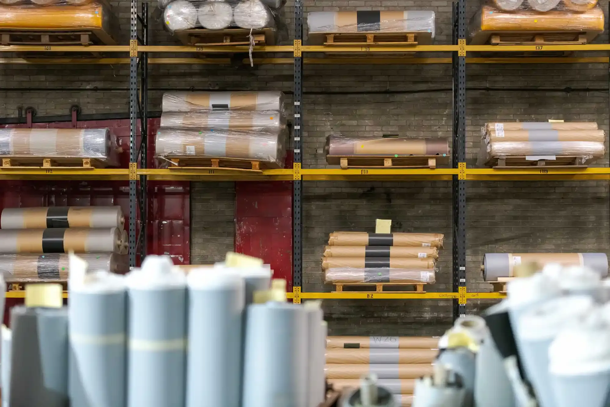 Shelves full of ambla fabric rolls