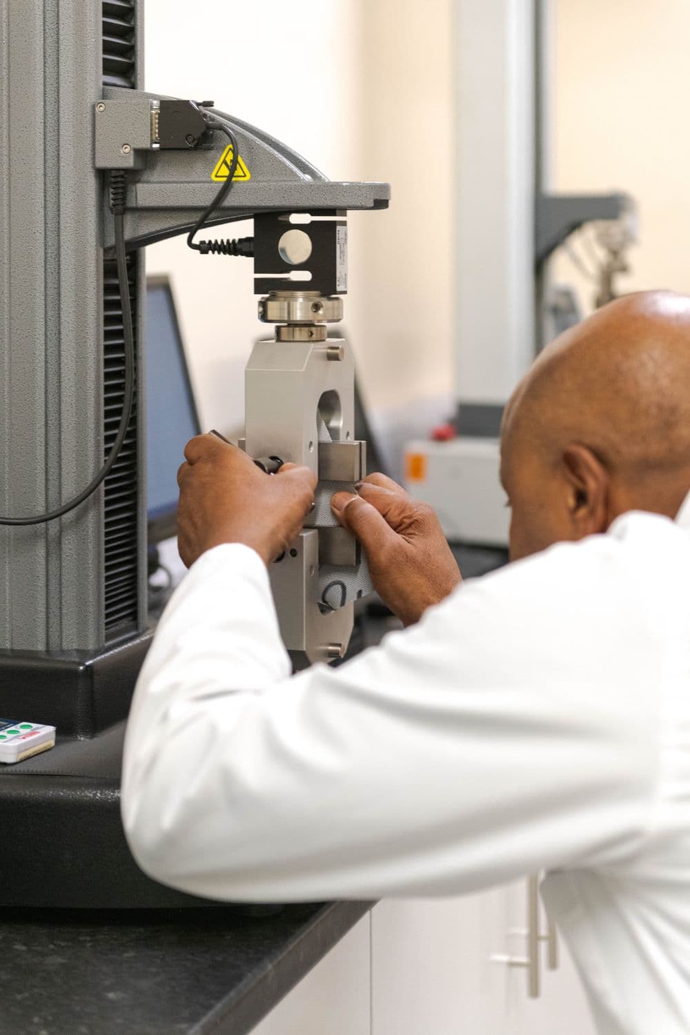 Man stitching a fabric